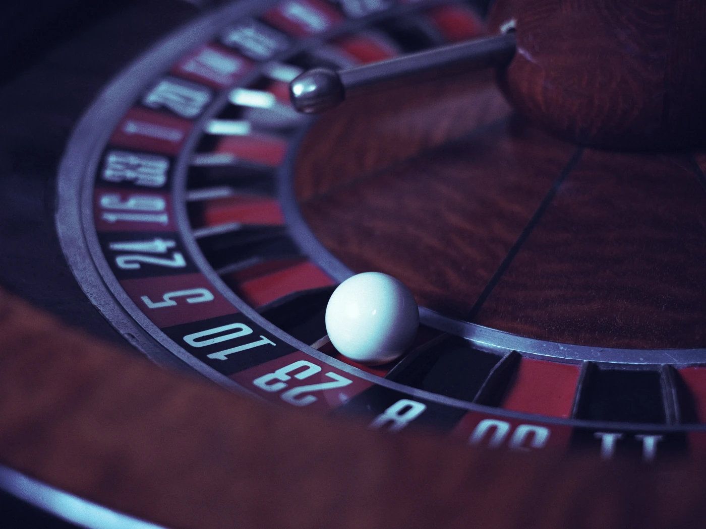 Ball on a roulette wheel in an online casino, close up